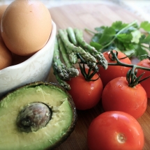 hard boiled egg, with avocado, tomato and asparagus