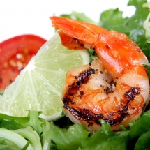 grilled shrimp with tomato and arugula salad.